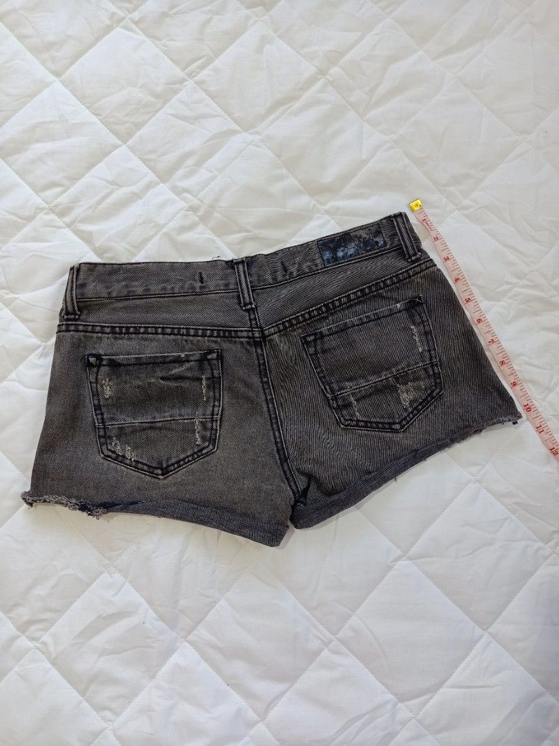 Distressed Denim Shorts Alt grunge dark (Category: Shorts) located in Manila. Submitted by haniberry (Listing ID 1396221695, Image 2). Description: - Distressed denim shorts - Dark grey wash - Ripped details - Classic design - Button and zipper closure - Raw hem - Comfortable for casual wear.