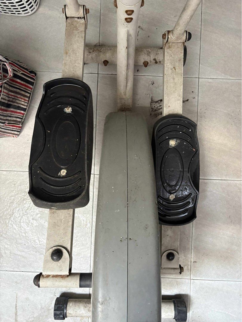 Elliptical Trainer exercise bike gym equipment (Category: Cardio & Fitness Machines) located in Manila. Submitted by jiden26 (Listing ID 1396247225, Image 3). Description: - needs deep cleaning lang - weights are still usable - Elliptical trainer with digital display - Adjustable resistance levels - Includes foot pedals and upper body handles - Stylish white frame with black accents - In good working condition.