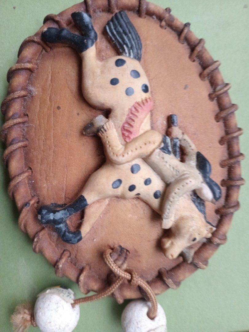 Embossed Cowboy and Horse Wall Decor (Category: Wall Decor) located in Manila. Submitted by padillahe35291 (Listing ID 1396130161, Image 1). Description: - Cowboy and horse ceramic display decor - Tan-colored material - Stitched border - Detailed painting of cowboy and horse - Includes black spots on the horse - Two white ball ornaments.