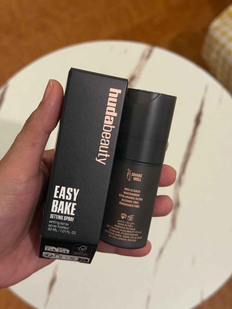 Huda Beauty Easy Bake Setting Spray (Category: Makeup) located in Quezon City. Submitted by quirksandcurls (Listing ID 1396143185, Image 2). Description: - Huda Beauty Easy Bake Setting Spray - Size: 30 ml / 1.01 fl. oz. - Alcohol-free & fragrance-free - Key Ingredients: Rice starch, niacinamide, hyaluronic acids - Made in Italy - Directions for use on box - Shake well before use.