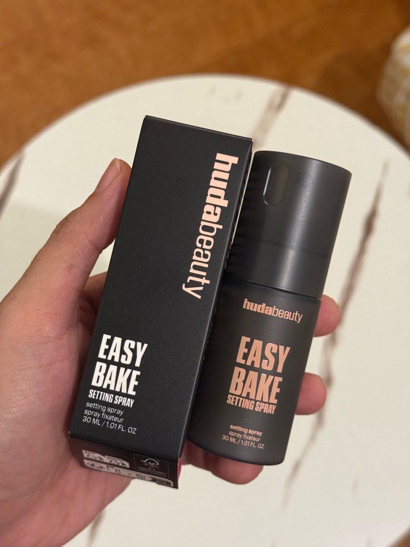 Huda Beauty Easy Bake Setting Spray (Category: Makeup) located in Quezon City. Submitted by quirksandcurls (Listing ID 1396143185, Image 1). Description: - Huda Beauty Easy Bake Setting Spray - Size: 30 ml / 1.01 fl. oz. - Alcohol-free & fragrance-free - Key Ingredients: Rice starch, niacinamide, hyaluronic acids - Made in Italy - Directions for use on box - Shake well before use.