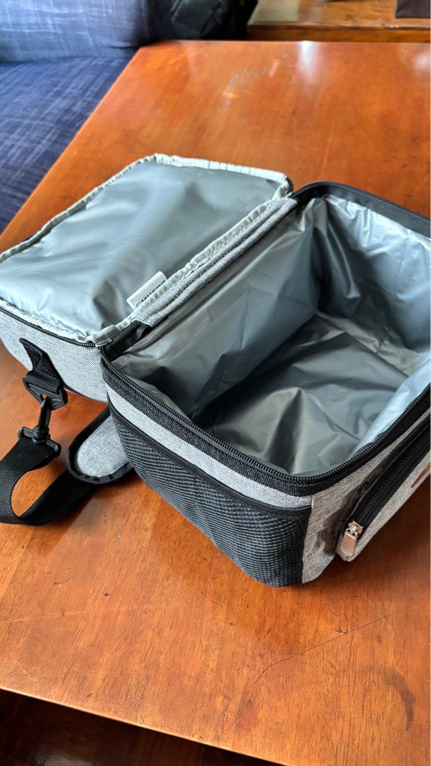 Insulated Lunch Bag with Shoulder Strap (Category: Food Organization & Storage) located in Quezon City. Submitted by notanniecruzlol (Listing ID 1396158546, Image 2). Description: - negotiable if you buy two or more items from my listings :) - dual-compartment design for food and drinks - has top handle and detachable shoulder strap - front and side pockets for extra storage - rfs: no one needs it.