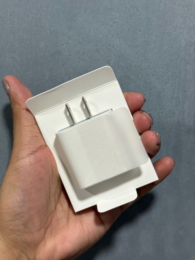 Original Apple USB - C 20W Power Adapter (Category: Chargers & Cables) located in Taguig. Submitted by russmerc1121 (Listing ID 1396267060, Image 3). Description: For Sale: Original Apple USB - C 20W Power Adapter • Brand new, never used (box opened only) • Reason for selling: Thought the adapter for iPhone 14 Pro Max and iPhone 16 Pro is different • Original Price ₱1,290.00. Selling for ₱1,000.00. DM me if you’re interested. Thank you❤️.