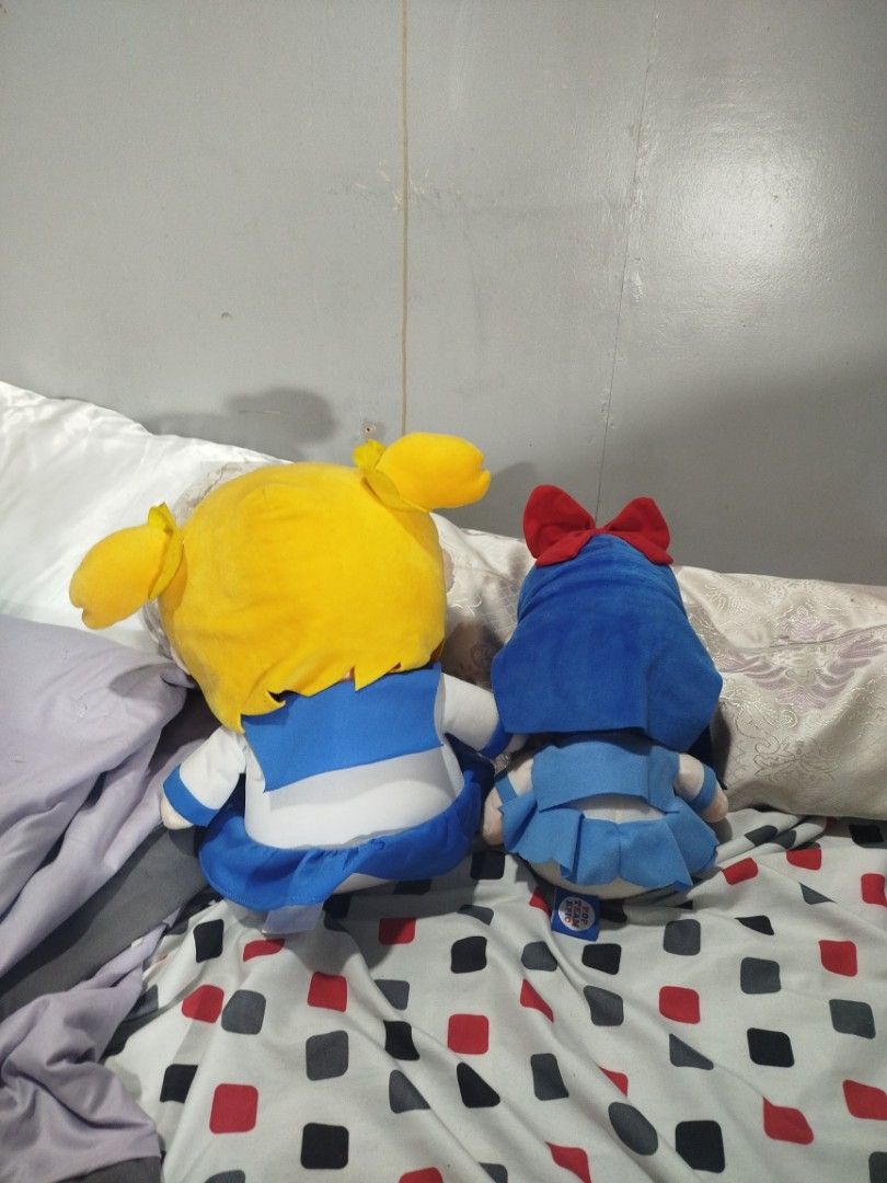 Pop Team Epic Plush SET (Category: Plushies & Soft Toys) located in Baguio. Submitted by shrimpytrinkies (Listing ID 1396186152, Image 2). Description: - Pop Team Epic plushies featuring Popuko and Pipimi. - Popuko has yellow hair. - Pipimi has blue hair and a red bow. - Both plushies wear their signature outfits. - Includes the Pop Team Epic tag..