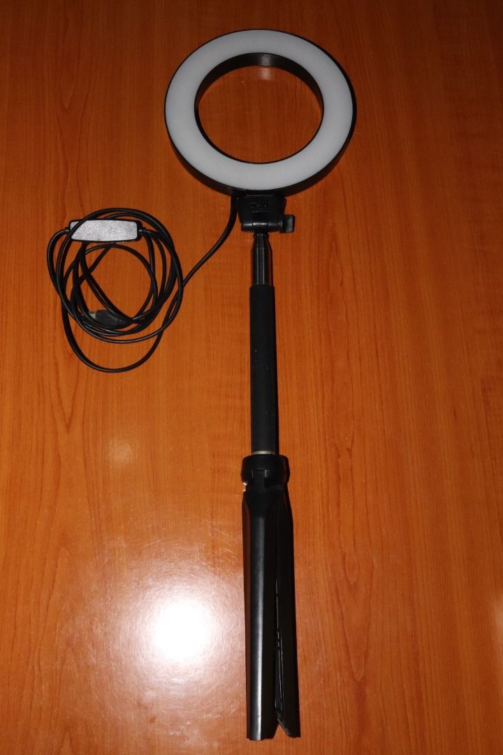 Portable Ring Light with Tripod Stand – 3 Light Modes, USB Powered, Adjustable & Tiltable (Category: Lighting & Studio Equipment) located in Quezon City. Submitted by mabait_na_posa (Listing ID 1396276456, Image 2). Description: No issues. Selling this for decluttering purposes. Key Features: - Triple light modes: warm, white, daylight - Foldable and portable tripod stand - Expandable/retractable height - 360° tiltable head - USB-powered with cab