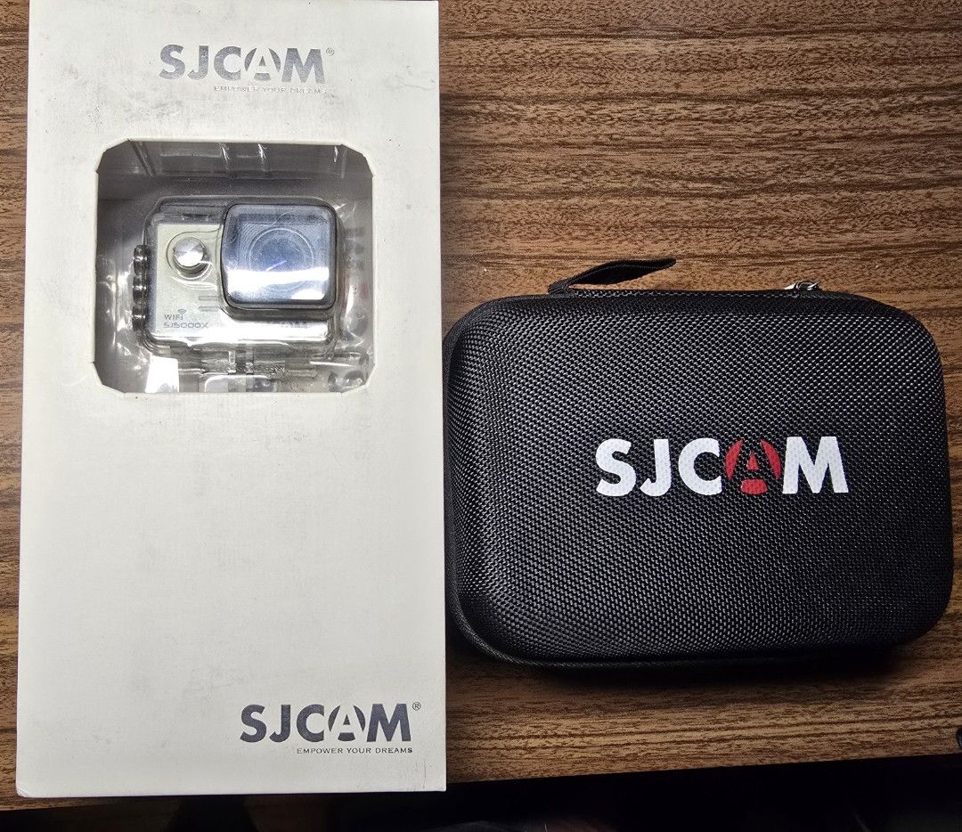 SJCAM SJ5000X Action Camera (Category: Cameras) located in Manila. Submitted by thegoodthingsinlife (Listing ID 1396160820, Image 1). Description: SJCAM SJ5000X action camera for sale. Includes waterproof case, carrying case, mounting accessories, two batteries, charger, box, and manual. Features built-in screen and Wi-Fi..