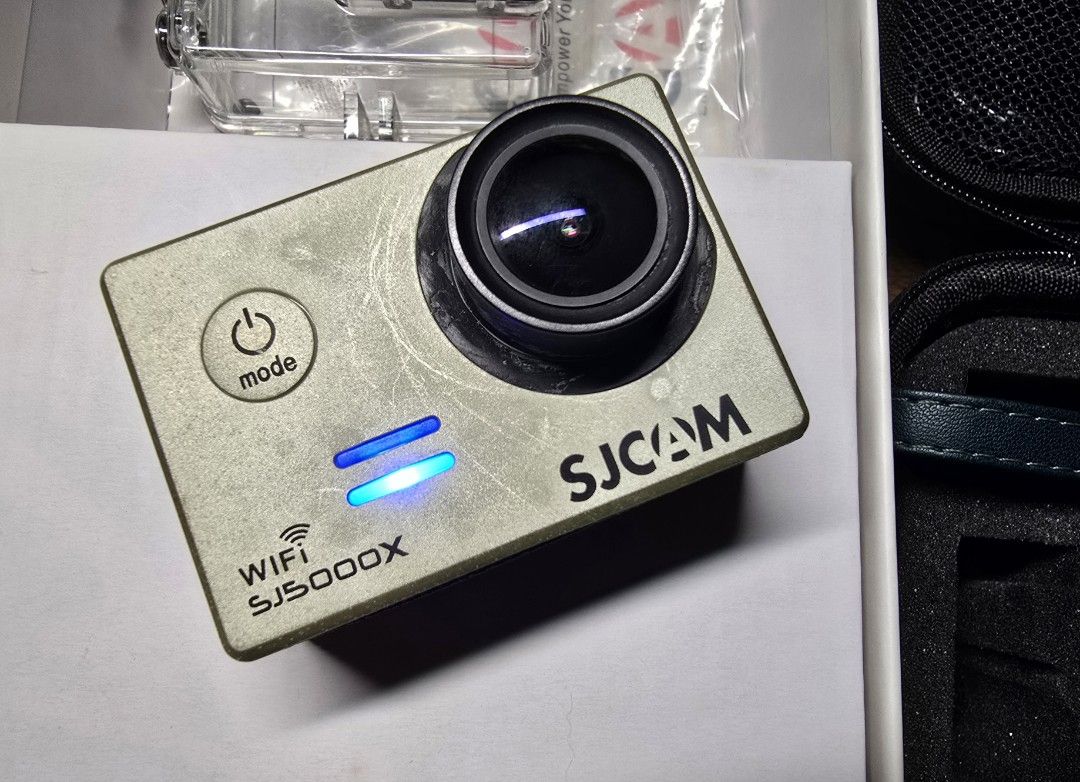 SJCAM SJ5000X Action Camera (Category: Cameras) located in Manila. Submitted by thegoodthingsinlife (Listing ID 1396160820, Image 2). Description: SJCAM SJ5000X action camera for sale. Includes waterproof case, carrying case, mounting accessories, two batteries, charger, box, and manual. Features built-in screen and Wi-Fi..