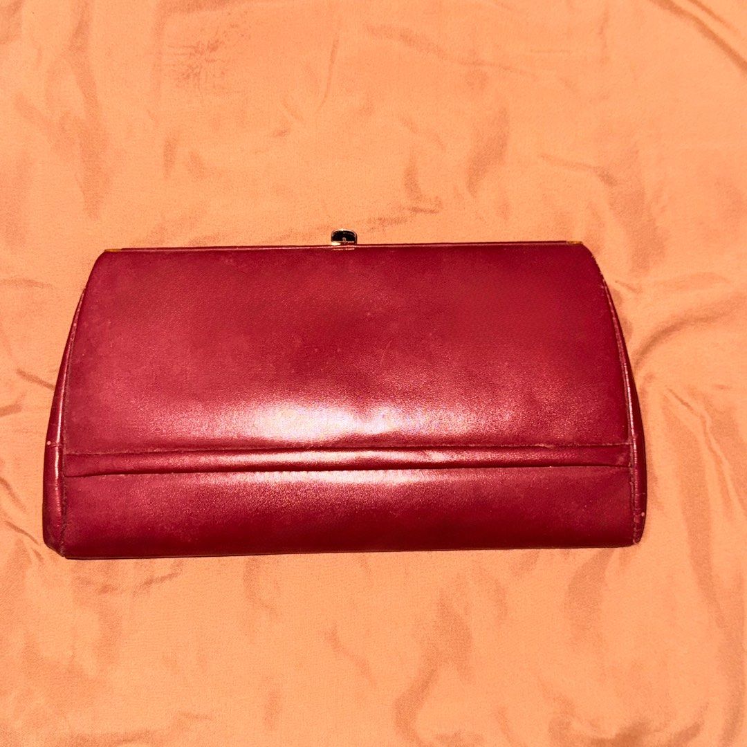 Vintage Maroon Handbag with Gold Handle (Category: Luxury Bags & Wallets) located in Marikina City. Submitted by declutter__me (Listing ID 1396279258, Image 2). Description: - used once only - Vintage maroon handbag - Gold-toned handle and frame - Secure clasp closure - Interior zippered pocket - Classic, structured design - Smooth, leather-like material - needs minimal cleaning only.