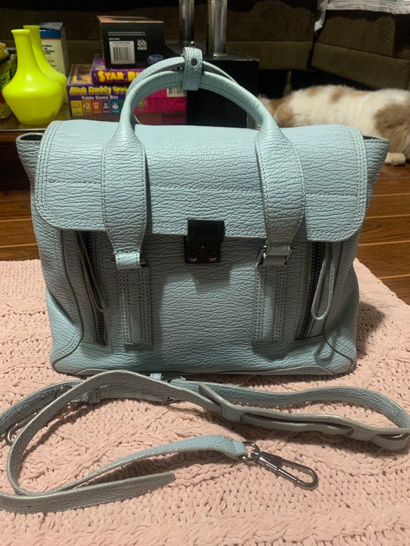 3.1 Phillip Lim Pashli Satchel (Category: Luxury Bags & Wallets) located in Bulacan. Submitted by love2loved (Listing ID 1401306275, Image 1). Description: 3.1 Phillip Lim Pashli satchel in a beautiful light blue color. Features a top handle, a detachable shoulder strap, and a flap closure with a push lock. The interior includes a main compartment and a zippered pocket. The bag has silver-tone hardware and the brand name is visible on the zipper.