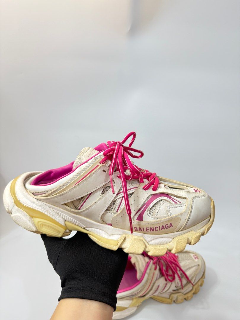 Balenciaga Track Mule Sneakers (Category: Sneakers) located in Manila. Submitted by ninalumbang (Listing ID 1401345127, Image 2). Description: - Balenciaga Track Mule sneakers - Color: White with pink accents - Size: 37 - Design: Lace-up with Balenciaga logo - Sole: Chunky - Interior: Pink.