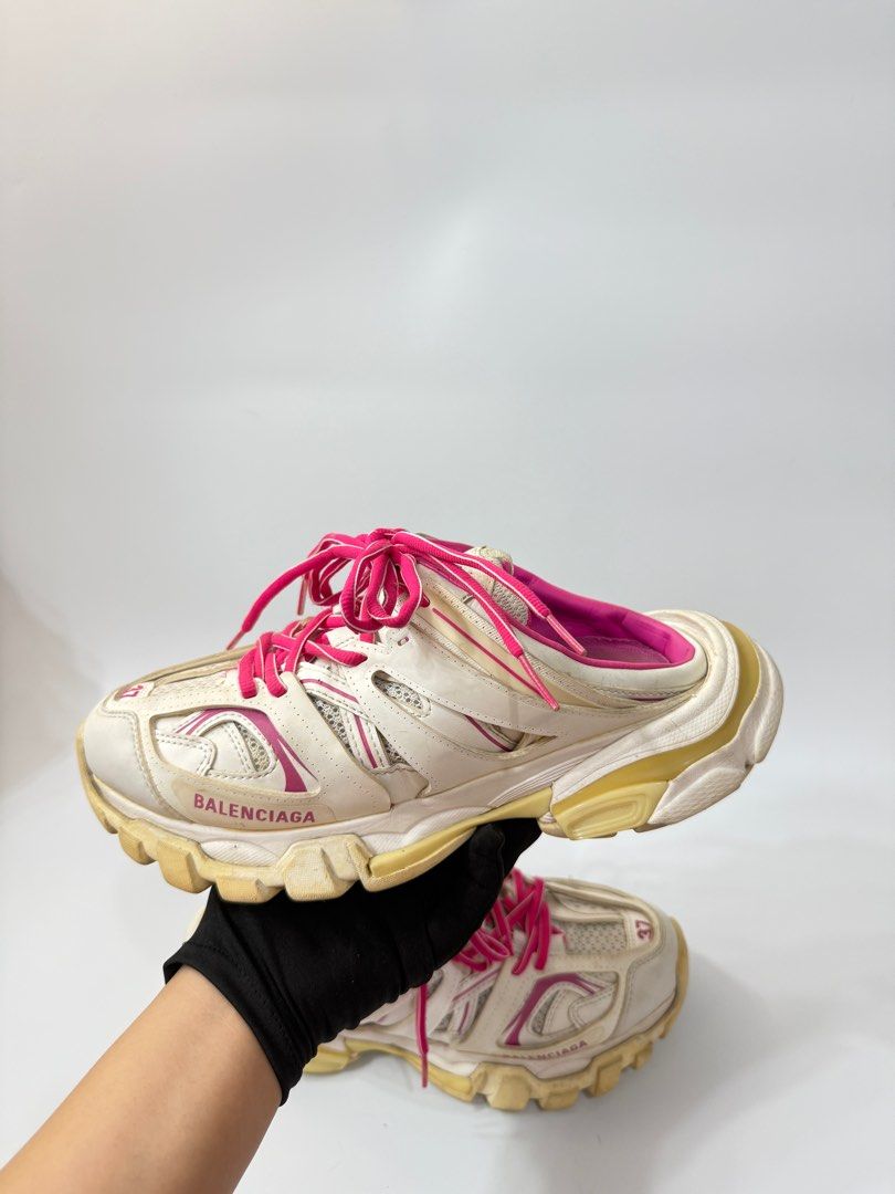 Balenciaga Track Mule Sneakers (Category: Sneakers) located in Manila. Submitted by ninalumbang (Listing ID 1401345127, Image 3). Description: - Balenciaga Track Mule sneakers - Color: White with pink accents - Size: 37 - Design: Lace-up with Balenciaga logo - Sole: Chunky - Interior: Pink.
