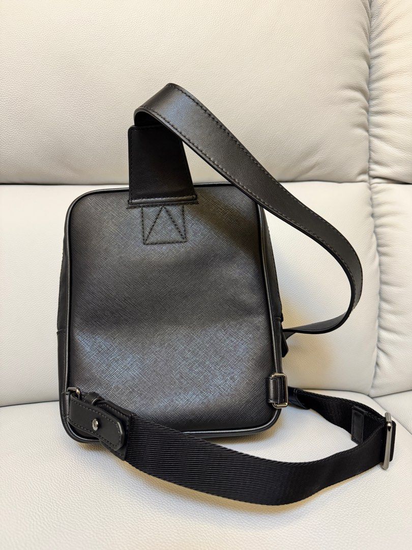 Bally Sling Bag with Stripe Detail (Category: Luxury Bags & Wallets) located in Manila. Submitted by ml0626 (Listing ID 1401298305, Image 2). Description: - Black Bally sling bag - Front compartment with red and white stripe - Top zip compartment - Adjustable shoulder strap - Bally logo embossed on top - Textured material Meet up only, item too expensive to ship.