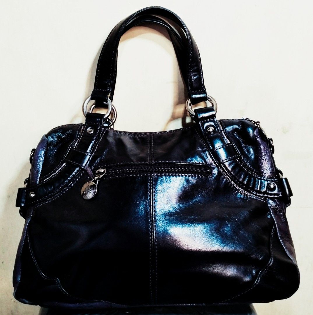 Bana Bana Black Handbag (Category: Tote Bags) located in Quezon City. Submitted by heavenleigh88qm (Listing ID 1401325582, Image 2). Description: - Black Bana Bana handbag - Dual top handles - Decorative charm - Glossy finish - Silver-tone hardware - Embossed bottom - Interior zipper pocket - Stylish accessory size : 11x8x3 1/2 inches posted pics and size 📌Manage expectations 📌mop:gcash and Maya 📌shipping shouldered by buyer jnt , grab, lalamo