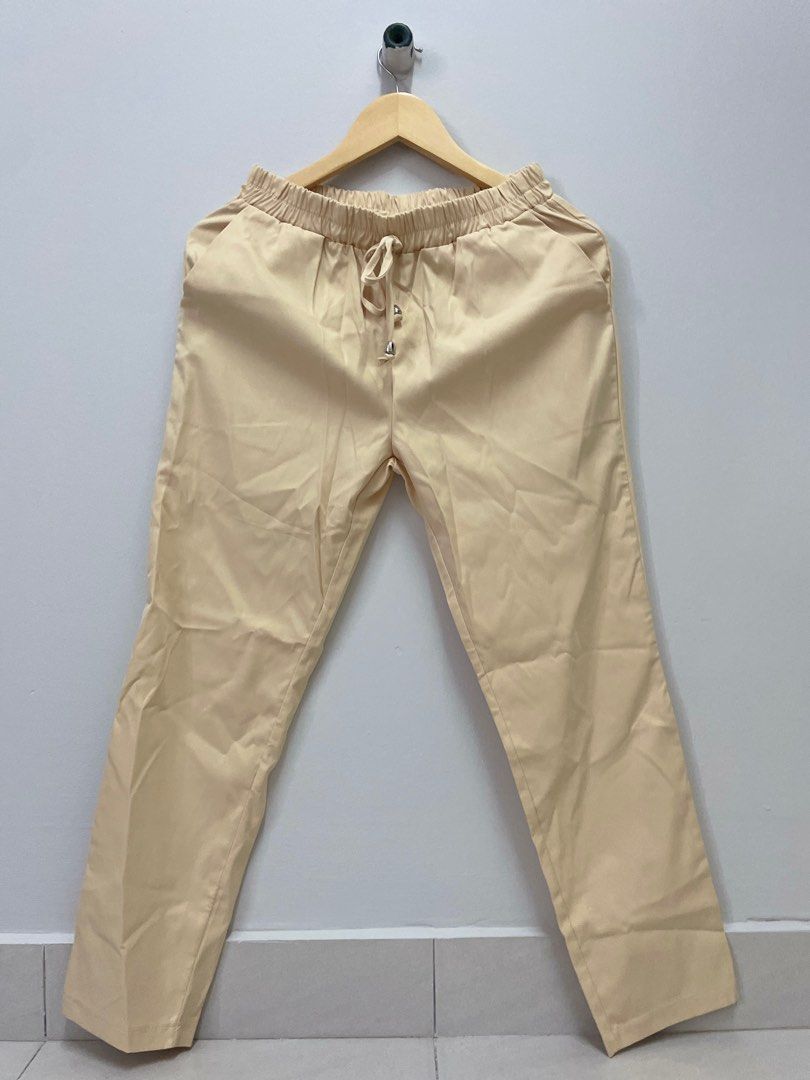 Beige Drawstring Pants (Category: Other Bottoms) located in Kuala Lumpur. Submitted by nadineeeeee (Listing ID 1401259166, Image 1). Description: - Beige pants - Drawstring waist - Relaxed fit - Straight leg - Two pockets - Lightweight, smooth fabric - Perfect for casual outfits.