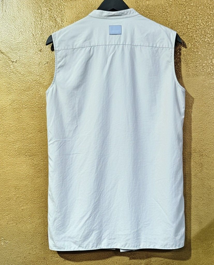 Burberry Sleeveless Shirt (Category: Luxury Apparel) located in Baguio. Submitted by cc1516 (Listing ID 1396626559, Image 2). Description: - Authentic Burberry sleeveless shirt - Light blue color - Mandarin collar and button-down front - Made in Italy - Size: UK 8, US 6, IT 40 - Material: 100% silk - Features a small front pocket - Burberry logo patch on the back.