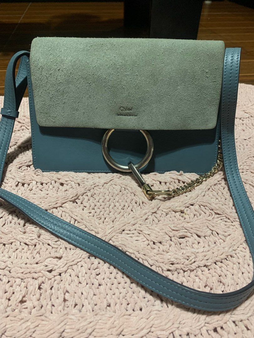 Chloe Faye Shoulder Bag (Category: Luxury Bags & Wallets) located in Bulacan. Submitted by love2loved (Listing ID 1401297168, Image 2). Description: - Color: Blue - Material: Suede flap and leather body - Straps: Chain strap and adjustable leather strap - Interior: Main compartment and small pocket - Details: Large metal ring detail - Made in Italy good condition signs of usage silver hardware small size 5 .5 inches length 9.5 inches width with c