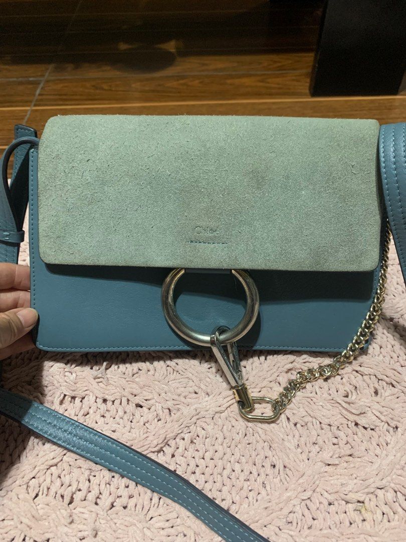 Chloe Faye Shoulder Bag (Category: Luxury Bags & Wallets) located in Bulacan. Submitted by love2loved (Listing ID 1401297168, Image 1). Description: - Color: Blue - Material: Suede flap and leather body - Straps: Chain strap and adjustable leather strap - Interior: Main compartment and small pocket - Details: Large metal ring detail - Made in Italy good condition signs of usage silver hardware small size 5 .5 inches length 9.5 inches width with c