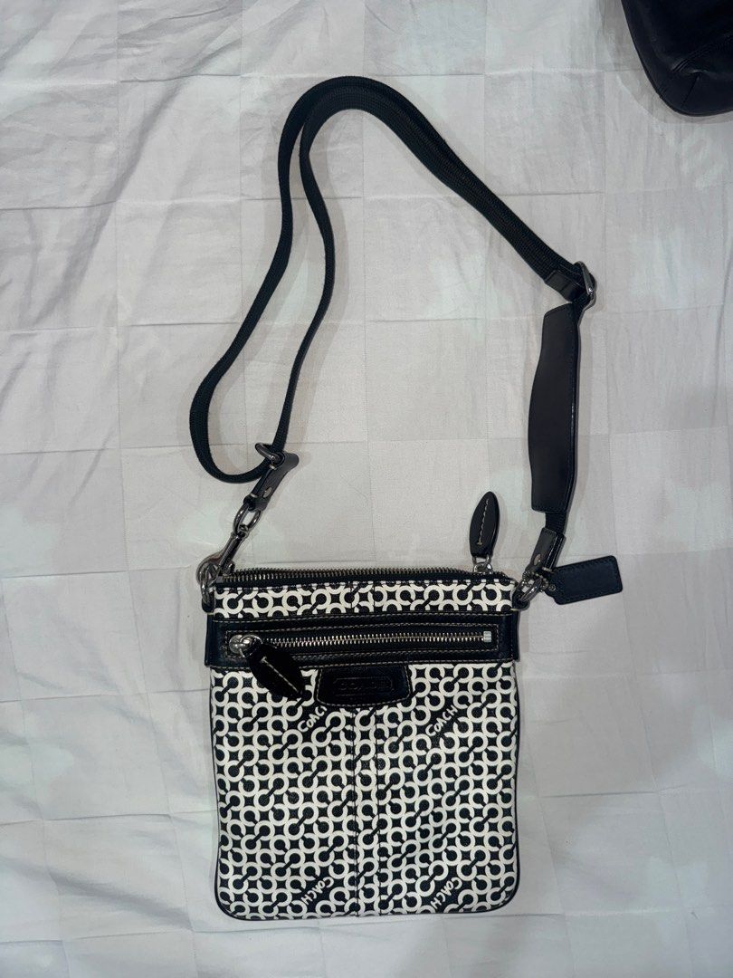 Coach Signature Crossbody Bag (Category: Luxury Bags & Wallets) located in Manila. Submitted by decluterrrr (Listing ID 1401296428, Image 3). Description: - Condition: barely used (<10 times), stored properly - No inclusions - Fits essentials such as all phones and long wallets - Coach crossbody bag - Signature black and white pattern - Zip closure - Adjustable strap - Exterior pocket - Coach logo detail.