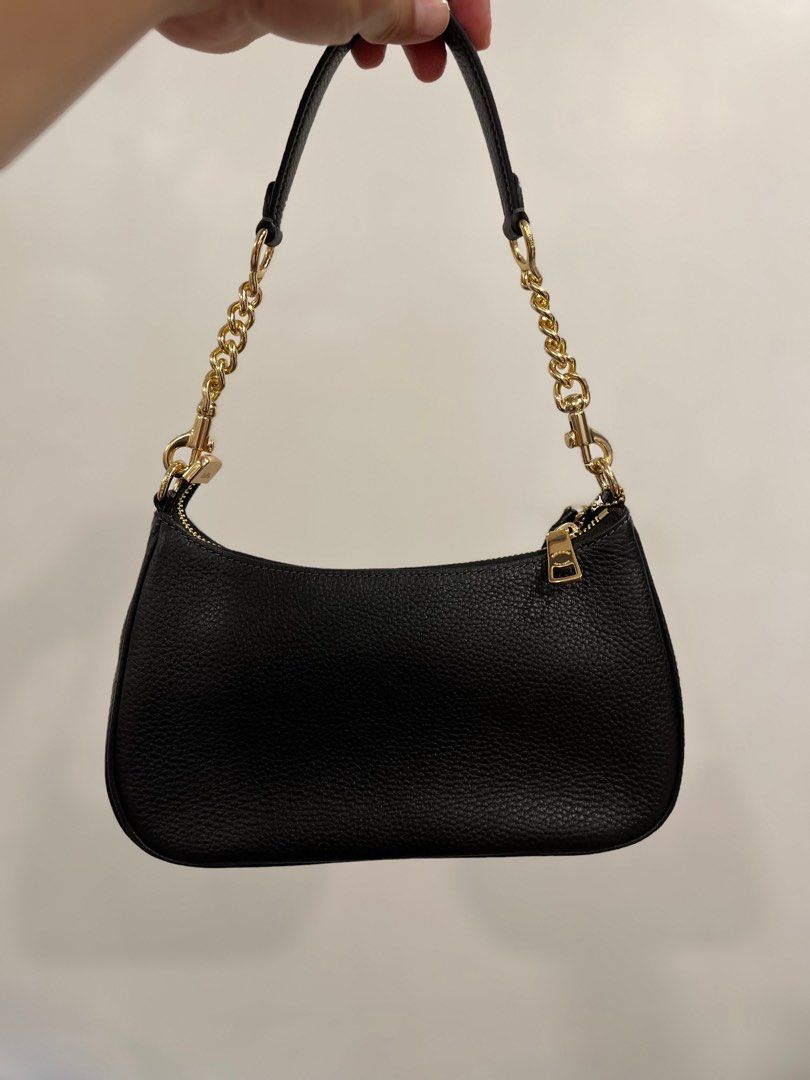 Coach teri (Category: Luxury Bags & Wallets) located in Manila. Submitted by luxwalletbags (Listing ID 1401286307, Image 2). Description: - Black Coach shoulder bag - Gold-tone chain strap - Zip closure - Small Coach logo - Rounded shape - Leather material - Detachable strap - Leather tag on zipper guaranteed original.