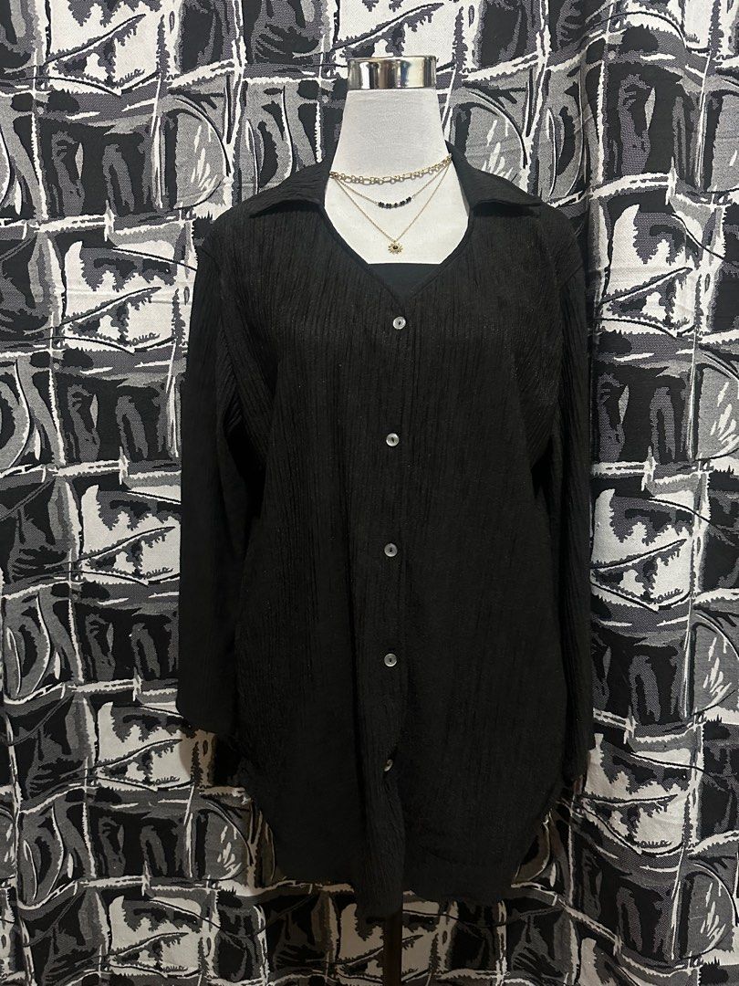 Costura Black Button-Up Blouse (Category: Blouses) located in Antipolo. Submitted by declutteringsizzy (Listing ID 1401256511, Image 2). Description: - Costura black button-up blouse - Collared neckline - Long sleeves - Textured, ribbed fabric - Made in the Philippines - Relaxed fit - Best fit to XL body frame - Width = 21in” - Length = 30in”.