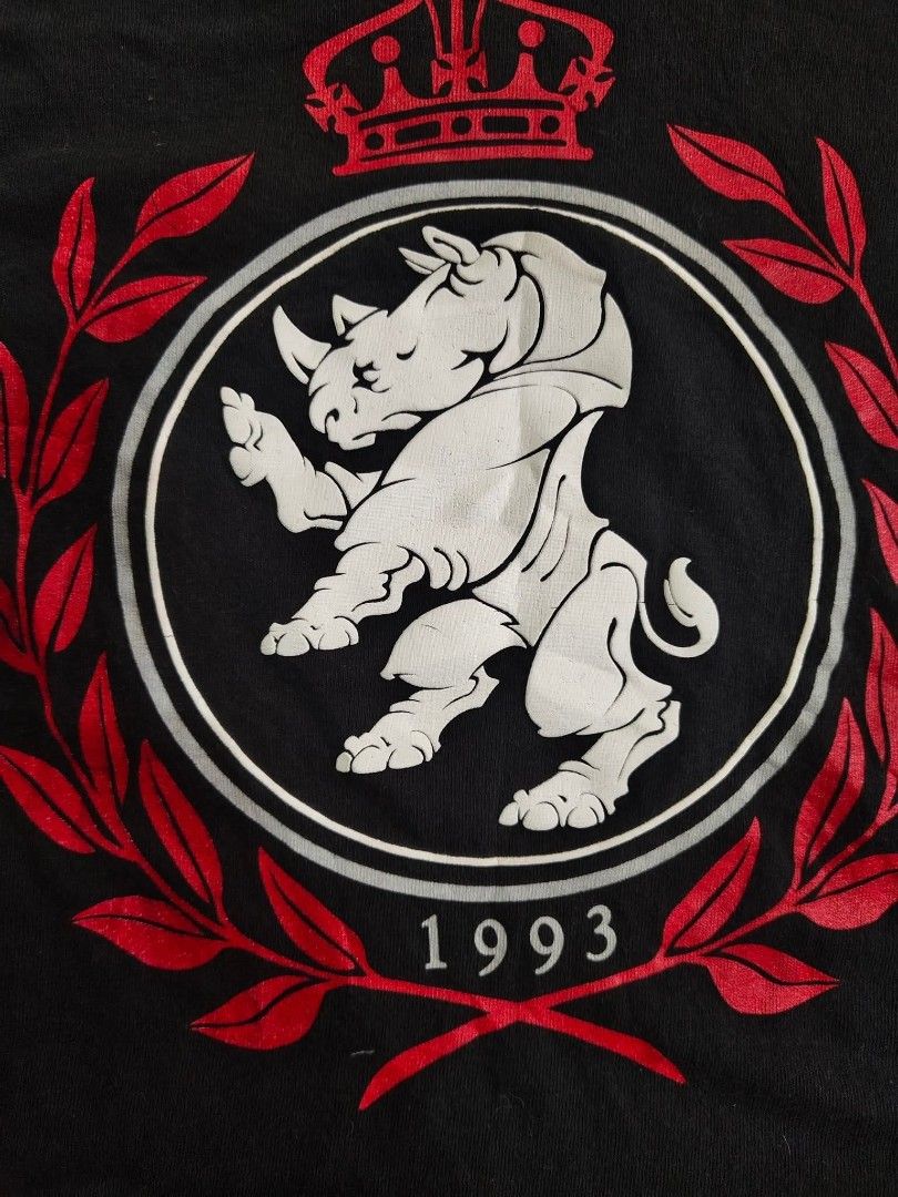 Ecko Unltd. XL T-Shirt (Category: Tshirts & Polo Shirts ) located in Trece Martires City. Submitted by warmix (Listing ID 1401346767, Image 2). Description: Authentic Ecko Unltd. T-shirt in size XL. Features a unique design with a rhino emblem and the year 1993. Made of 100% cotton. The shirt is black with a red and white graphic. Made in Mexico..