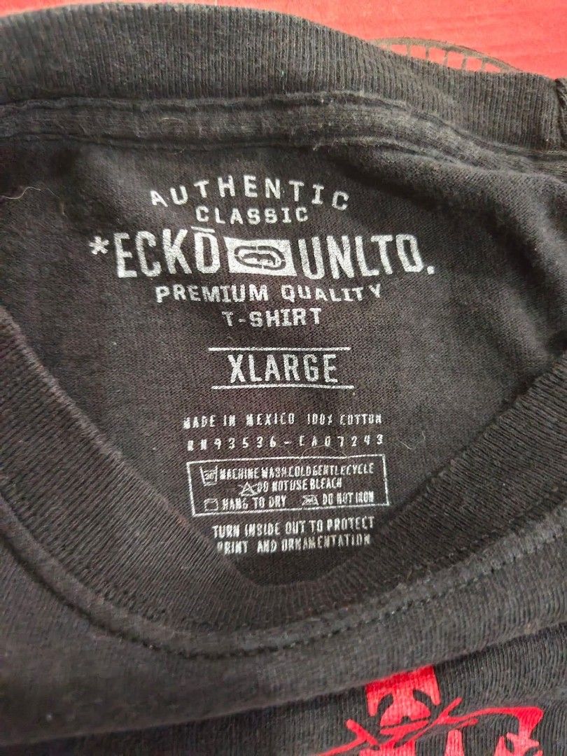 Ecko Unltd. XL T-Shirt (Category: Tshirts & Polo Shirts ) located in Trece Martires City. Submitted by warmix (Listing ID 1401346767, Image 3). Description: Authentic Ecko Unltd. T-shirt in size XL. Features a unique design with a rhino emblem and the year 1993. Made of 100% cotton. The shirt is black with a red and white graphic. Made in Mexico..