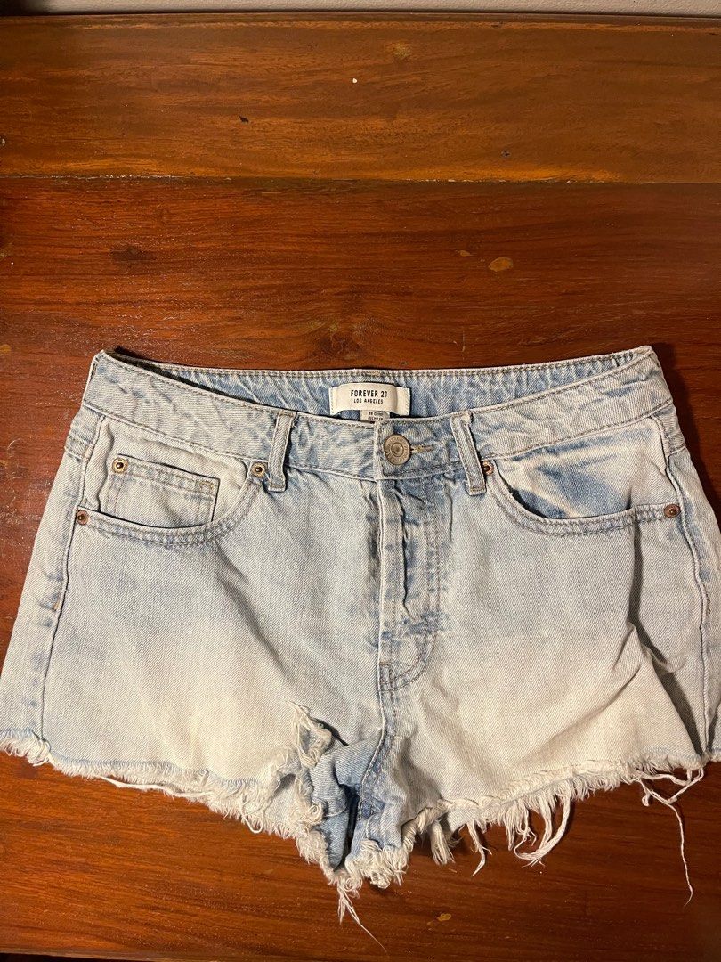 Forever 21 Denim Shorts (Category: Shorts) located in Quezon City. Submitted by d.archives (Listing ID 1401191422, Image 1). Description: - Forever 21 denim shorts - Light wash - Classic five-pocket design - Button and zipper closure - Frayed hem - Light blue color - Casual and perfect for everyday wear.