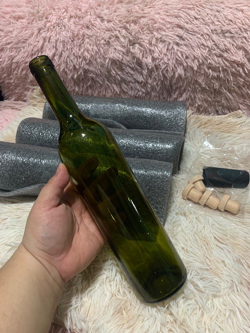 Green Wine Bottle with Corks (Category: Water Bottles & Tumblers) located in Cainta. Submitted by alisonolshoppe (Listing ID 1401312910, Image 2). Description: 4pcs - Empty green wine bottle - Includes corks and black stopper - Perfect for DIY projects - Great for home decor - Clean and ready to use.
