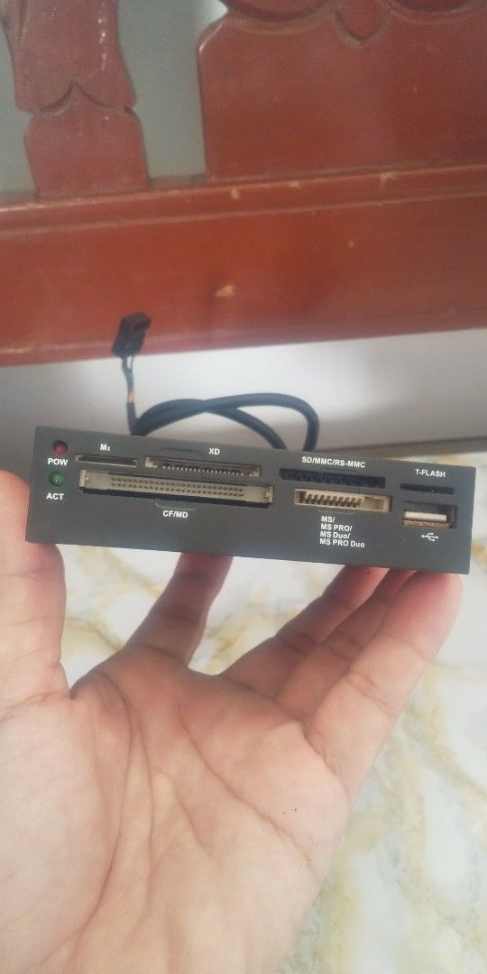 Internal Card Reader with USB Port (Category: Other Accessories) located in Carmona. Submitted by rpute (Listing ID 1401254107, Image 2). Description: Internal card reader supports various memory card formats, including SD, CF, MS, and XD. It also features a USB port for additional connectivity. The device has a black finish and includes a cable for internal connection..