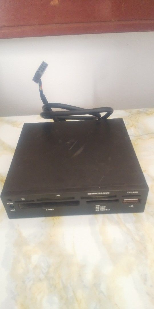 Internal Card Reader with USB Port (Category: Other Accessories) located in Carmona. Submitted by rpute (Listing ID 1401254107, Image 1). Description: Internal card reader supports various memory card formats, including SD, CF, MS, and XD. It also features a USB port for additional connectivity. The device has a black finish and includes a cable for internal connection..