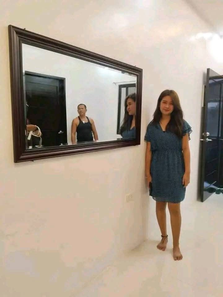 Large Rectangular Wall Mirror (Category: Mirrors) located in Mabalacat. Submitted by arlenemamangun01 (Listing ID 1401208356, Image 2). Description: Large rectangular wall mirror with a dark wooden frame. The mirror is suitable for living rooms, bedrooms, or hallways. It is a good size for checking your outfit or adding a decorative touch to your space. The mirror is 29x52 inches..