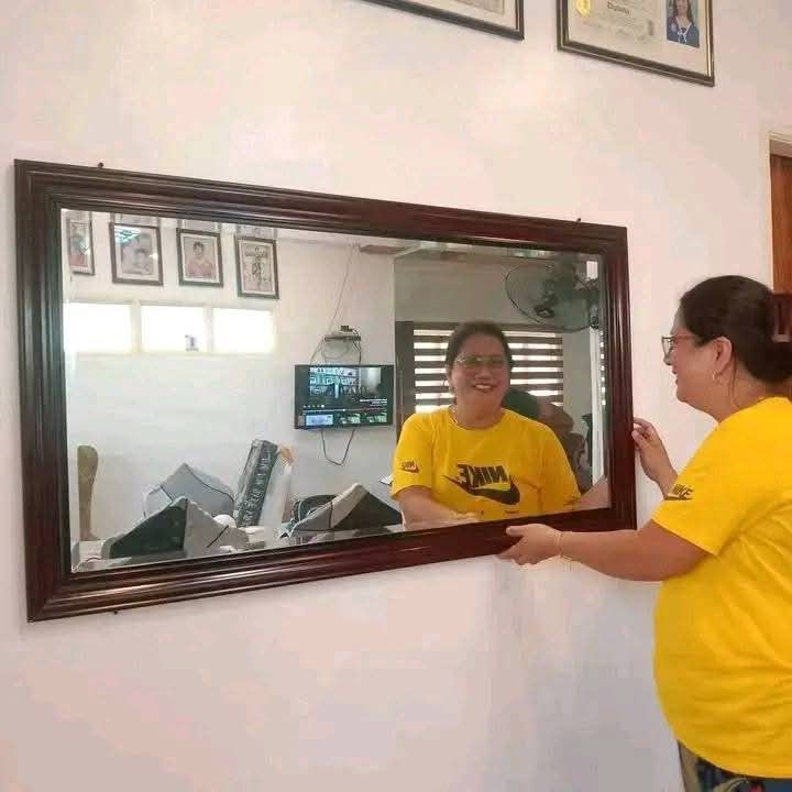 Large Rectangular Wall Mirror (Category: Mirrors) located in Mabalacat. Submitted by arlenemamangun01 (Listing ID 1401208356, Image 3). Description: Large rectangular wall mirror with a dark wooden frame. The mirror is suitable for living rooms, bedrooms, or hallways. It is a good size for checking your outfit or adding a decorative touch to your space. The mirror is 29x52 inches..