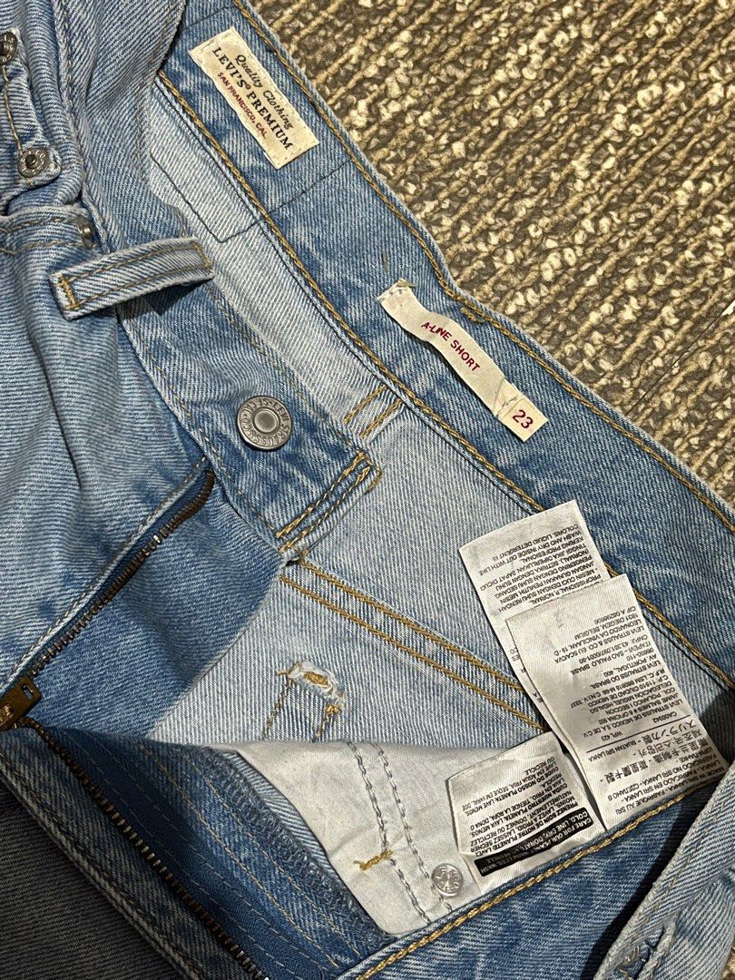 Levi's 501 Shorts - Size 23-24 (Category: Shorts) located in Lapu Lapu. Submitted by freebear-196d (Listing ID 1401306194, Image 3). Description: - Levi's 501 denim shorts - Light wash - Size 23 - High-waisted fit - Unique white side panels - Classic five-pocket design - Button fly.