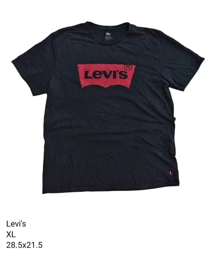 Levi's Black XL T-Shirt (Category: Tshirts & Polo Shirts ) located in Trece Martires City. Submitted by warmix (Listing ID 1401203230, Image 1). Description: Authentic Levi's black t-shirt in XL size. Features the iconic Levi's logo on the front. Made in El Salvador. Includes the Levi's red tab on the side. The shirt has care instructions and size details on the inner tags..