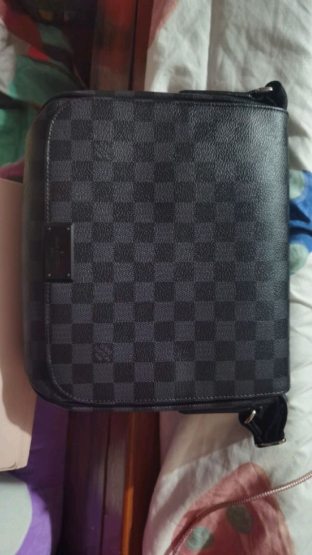 Louis Vuitton Messenger Bag (Category: Luxury Bags & Wallets) located in Caloocan City. Submitted by lux_sellier (Listing ID 1401231187, Image 2). Description: - Louis Vuitton Messenger Bag - Damier Graphite pattern - Flap closure - Adjustable shoulder strap - Interior with multiple compartments - Includes branded leather tag: "Louis Vuitton Paris made in France" Brand: LOUIS VUITTON Measures: 9.5" L x 9" H x 3" D (approx) 13"-28" Strap Drop, adj