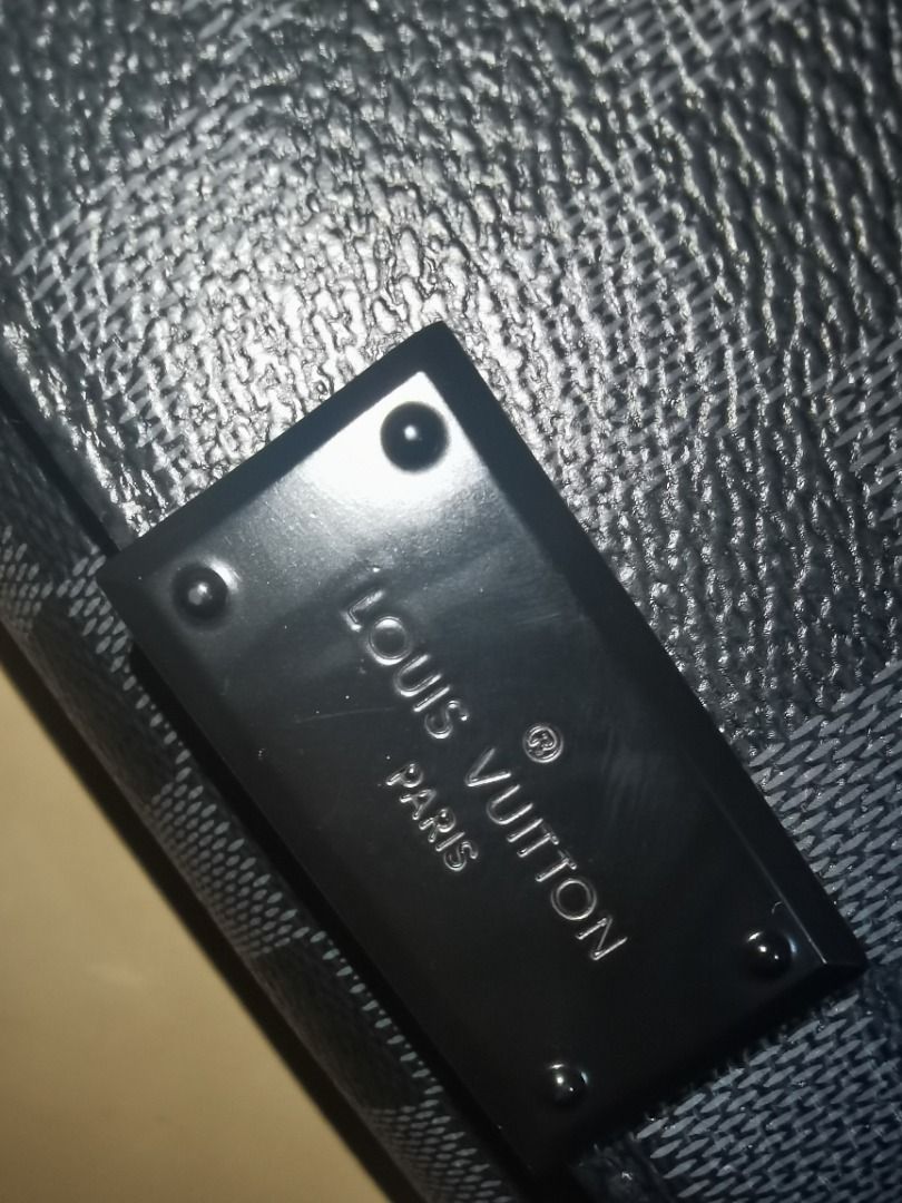 Louis Vuitton Messenger Bag (Category: Luxury Bags & Wallets) located in Caloocan City. Submitted by lux_sellier (Listing ID 1401231187, Image 3). Description: - Louis Vuitton Messenger Bag - Damier Graphite pattern - Flap closure - Adjustable shoulder strap - Interior with multiple compartments - Includes branded leather tag: "Louis Vuitton Paris made in France" Brand: LOUIS VUITTON Measures: 9.5" L x 9" H x 3" D (approx) 13"-28" Strap Drop, adj