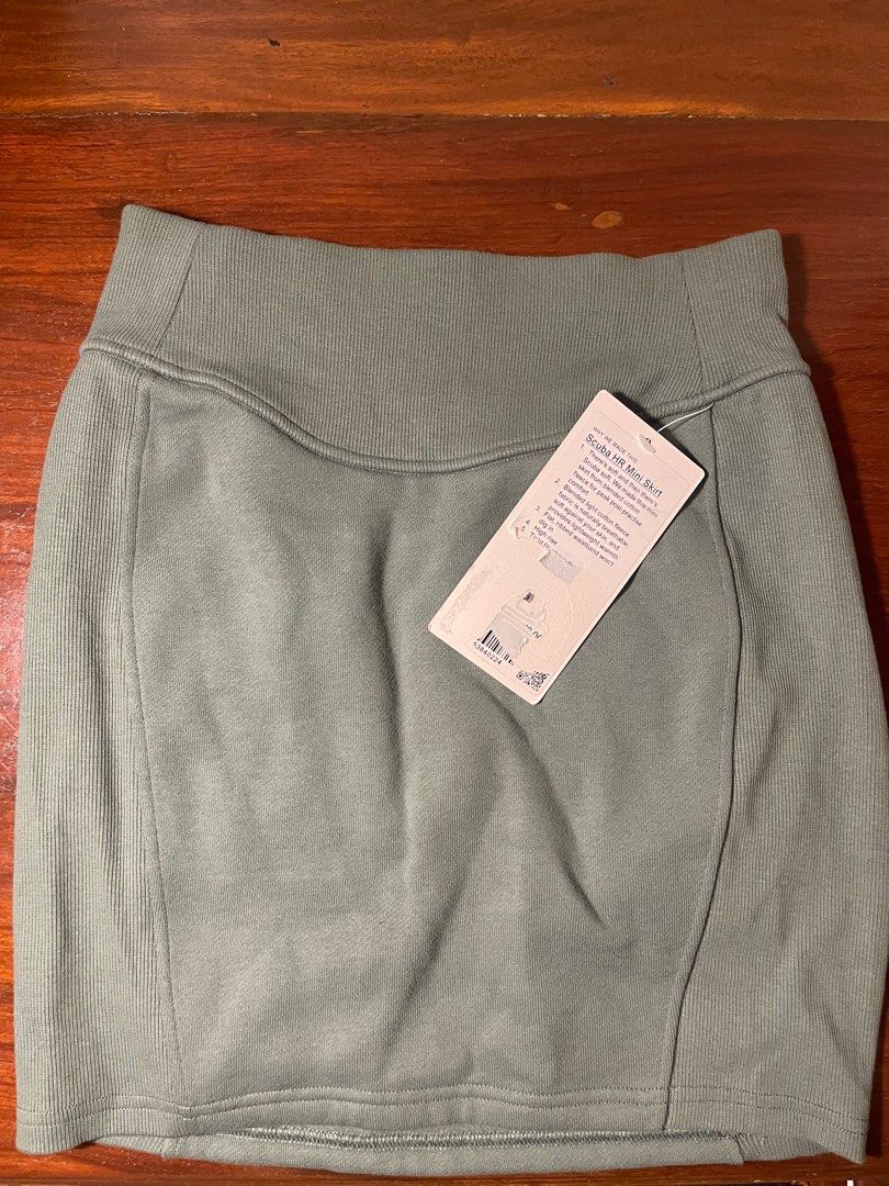Lululemon Scuba High-Rise Mini Skirt (Category: Skirts) located in Quezon City. Submitted by d.archives (Listing ID 1401235924, Image 2). Description: - Lululemon Ribbed Mini Skirt - Color: Muted Green - Design: High-waisted, mini length - Condition: New with original tag - Ideal for: Casual wear, workouts - Fabric: Comfortable and durable.