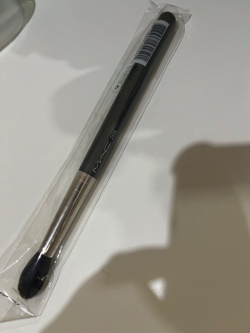 MAC 240S large tapered Blending makeup Brush (Category: Makeup) located in Manila. Submitted by marylouche42170 (Listing ID 1401166882, Image 1). Description: - MAC 240S large tapered blending makeup brush - Brand new and unused - Still in original packaging - Features a black handle and silver ferrule - Dark, rounded brush head - Includes barcode sticker.