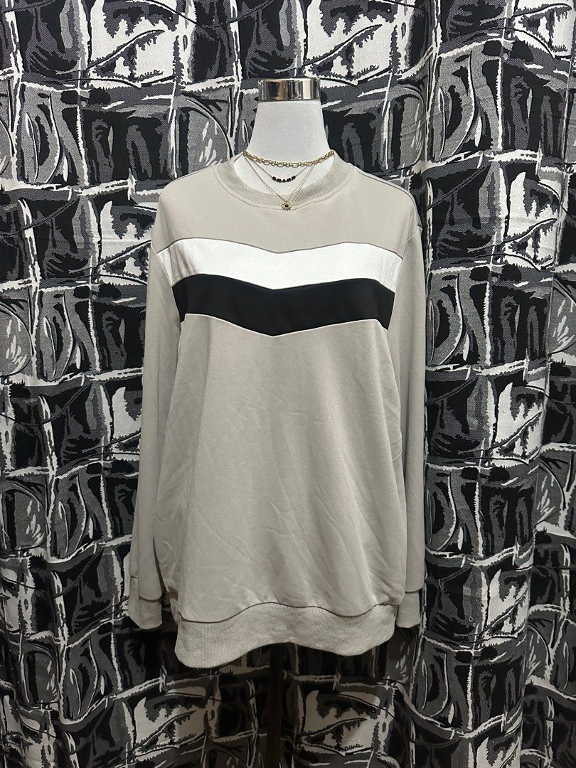 Manfinity 1XL Color Block Sweatshirt (Category: Coats, Jackets and Outerwear) located in Antipolo. Submitted by declutteringsizzy (Listing ID 1401290029, Image 2). Description: - Manfinity sweatshirt - Size: 1XL - Color block design - Neutral base with white and black stripes - Crew neck - Long sleeves - Comfortable, casual fabric - Perfect for casual wear - Width = 24in” - Length = 28in”.