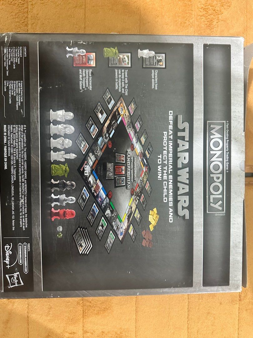 Monopoly Star Wars The Mandalorian Board Game (Category: Board Games & Puzzles) located in Manila. Submitted by kyleizs2n32753 (Listing ID 1401247303, Image 2). Description: Monopoly Star Wars The Mandalorian board game features a unique design. It includes game pieces, cards, and tokens. The game is for 2-4 players, ages 8 and up. The goal is to defeat Imperial enemies and protect the Child to win. The box shows the game board and components..