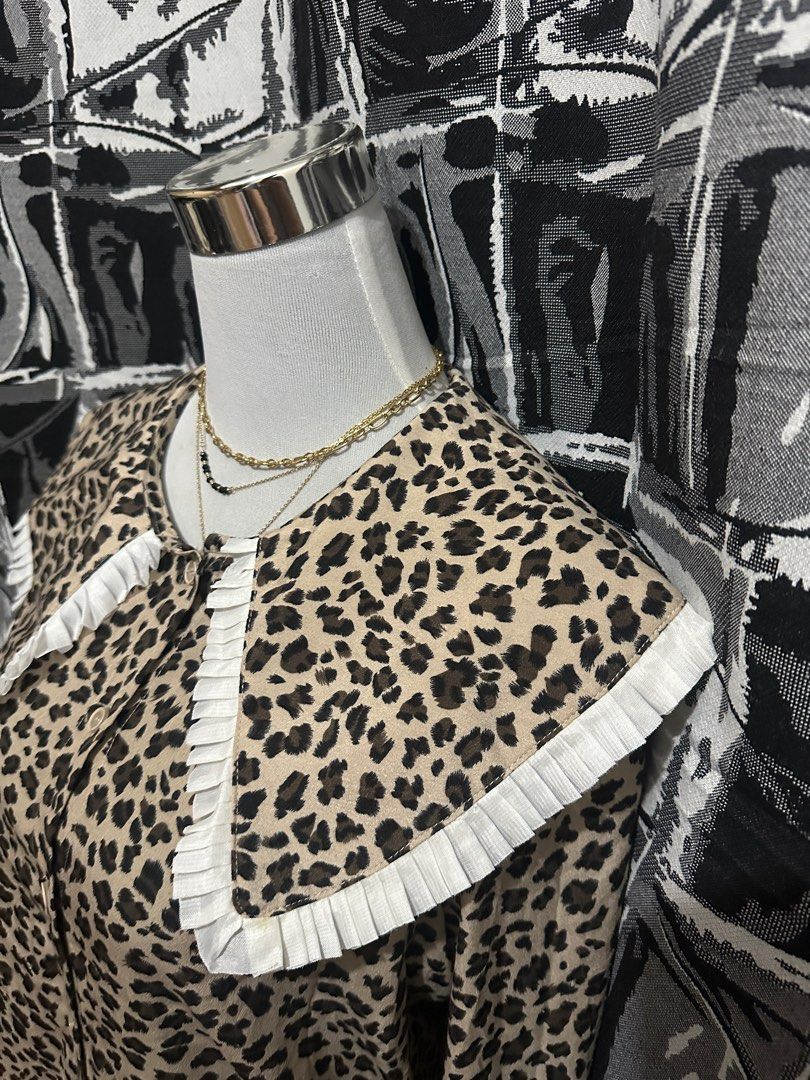 m.two Studio Leopard Print Blouse (Category: Blouses) located in Antipolo. Submitted by declutteringsizzy (Listing ID 1401295847, Image 3). Description: - M.TWO Studio blouse - Leopard print design - Unique collar with white trim - Long sleeves - Button-down front - Adds a stylish touch to any outfit .