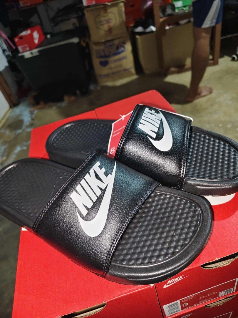 Nike Benassi Slides Black (Category: Slippers & Slides) located in Manila. Submitted by basiclang (Listing ID 1401336321, Image 1). Description: - Nike Benassi slides - Color: Black -size 12us - Features Nike logo - Includes original box and tags - Perfect for casual wear - Comfortable and stylish.