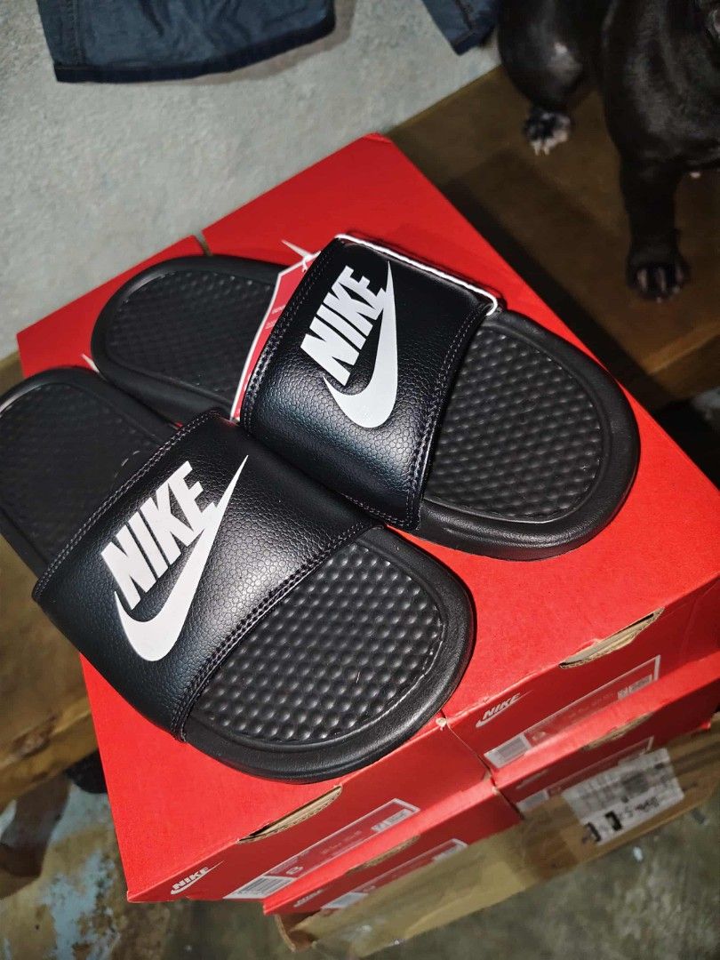 Nike Benassi Slides Black (Category: Slippers & Slides) located in Manila. Submitted by basiclang (Listing ID 1401336321, Image 2). Description: - Nike Benassi slides - Color: Black -size 12us - Features Nike logo - Includes original box and tags - Perfect for casual wear - Comfortable and stylish.