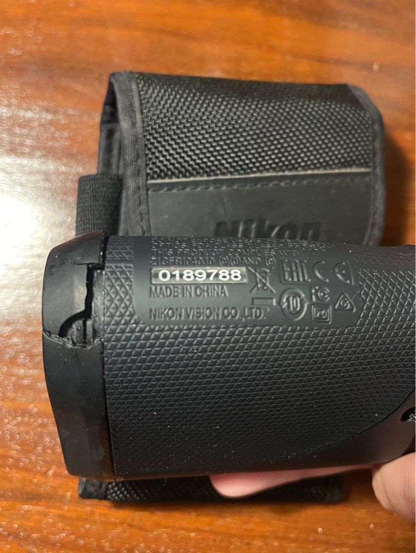 Nikon ACULON Rangefinder (Category: Golf) located in Quezon City. Submitted by d.archives (Listing ID 1401351050, Image 3). Description: Nikon ACULON rangefinder with carrying case. The rangefinder is black and includes a wrist strap. The model number is ACULON, and the serial number is 0189788. The carrying case is also black and features the Nikon logo. RFS: use garmin minor flaw: plastic cracked but does not affect performance of the rangefind