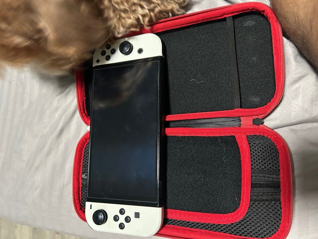 Nintendo Switch Oled (Category: Cases & Sleeves) located in San Pedro. Submitted by carrot_carrot (Listing ID 1401185463, Image 2). Description: For sale or swap to Ipad/Tablet Nintendo switch Oled with Mobopad controller 2 cases 1 8bitdo controller pwede din isama mga physical games depende sa model na iswap .