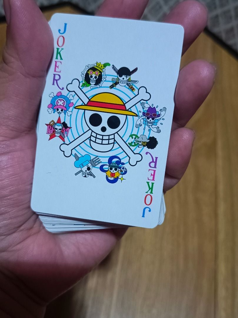 One Piece Playing Cards (Category: Board Games & Puzzles) located in Makati City. Submitted by nyxhemera26 (Listing ID 1401290492, Image 2). Description: - Complete deck of One Piece-themed playing cards. - Features various characters from the anime. - Includes the original box. - Clear images with minimal wear. - Perfect for fans and collectors..