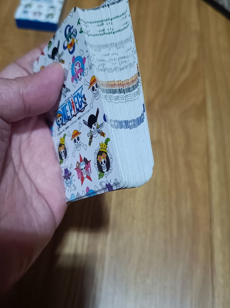 One Piece Playing Cards (Category: Board Games & Puzzles) located in Makati City. Submitted by nyxhemera26 (Listing ID 1401290492, Image 3). Description: - Complete deck of One Piece-themed playing cards. - Features various characters from the anime. - Includes the original box. - Clear images with minimal wear. - Perfect for fans and collectors..
