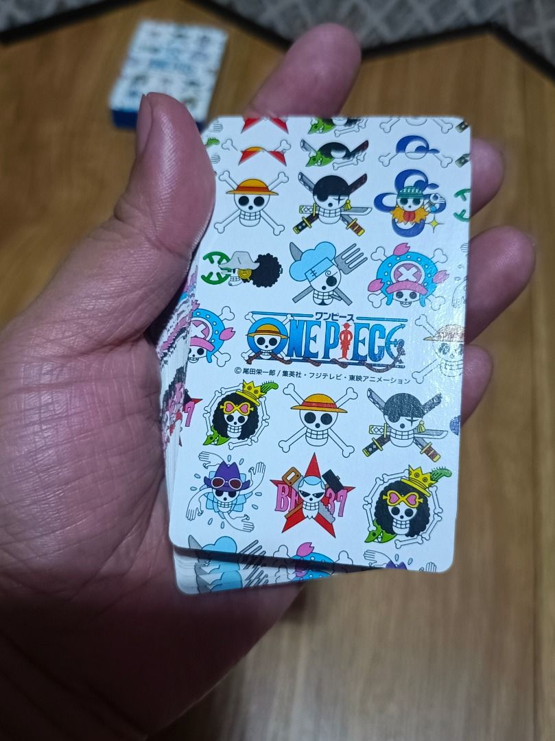 One Piece Playing Cards (Category: Board Games & Puzzles) located in Makati City. Submitted by nyxhemera26 (Listing ID 1401290492, Image 1). Description: - Complete deck of One Piece-themed playing cards. - Features various characters from the anime. - Includes the original box. - Clear images with minimal wear. - Perfect for fans and collectors..