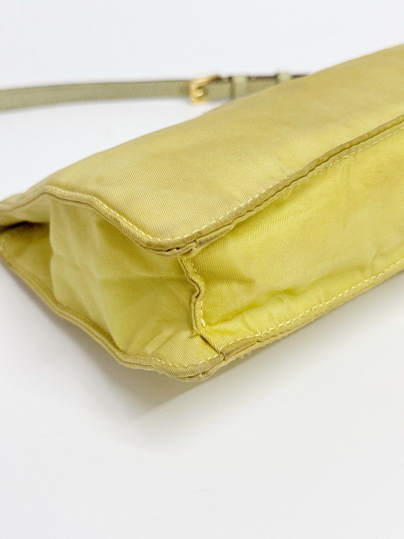 Prada Nylon Pochette (Category: Luxury Bags & Wallets) located in Taguig. Submitted by shoppiaholic (Listing ID 1401226595, Image 3). Description: Rank B+ No inclusions Authentic 100% - Vibrant yellow color - Interior lining visible.