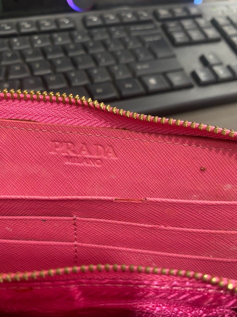 Prada Pink Zip Around Wallet (Category: Luxury Bags & Wallets) located in General Trias. Submitted by mangu_ukay (Listing ID 1401169779, Image 2). Description: Sign of used lampo zip.